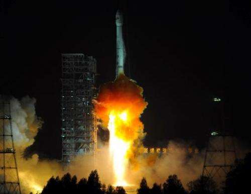 A Chinese Long March-3B carrier rocket blasts off from the Xichang satellite launch centre in Sichuan, China on December 21, 201