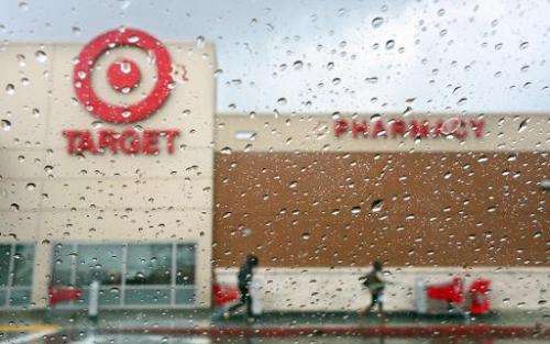 A couple of shoppers leave a Target store on a rainy afternoon in Alhambra, California on December 19, 2013