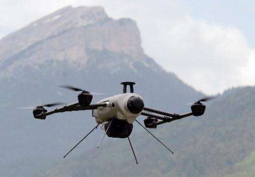 A Delta drone flies over the Chartreuse mountain range during a training session on June 20, 2013 in eastern France