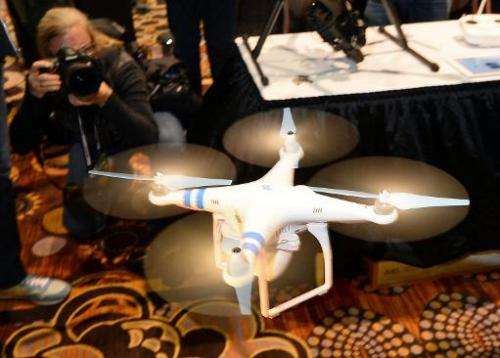 A DJI Innovations DJI Phantom 2 Vision aerial system is demonstrated in flight during a press event at the Mandalay Bay Conventi