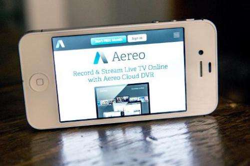 Aereo, a web service that provides television shows online, is displayed on an iPhone 4S screen