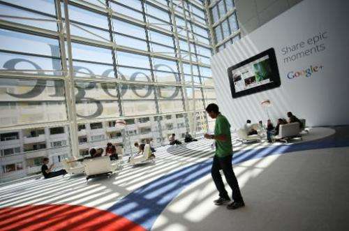 A Google logo is seen through the windows of Moscone Center in San Francisco during Google's annual developer conference on June