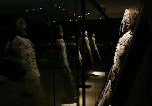 A group of Chinchorro mummies on display in the cultural centre of the La Moneda presidential palace in Santiago, on August 27, 
