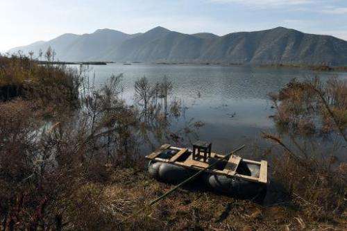 A home-made raft is seen beside an expanded section of the Danjiangkou reservoir near Jianying village in China's central Henan 