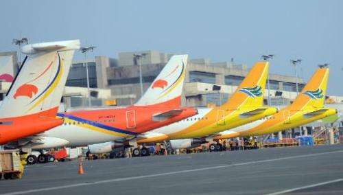 Aircraft of Philippine's largest budget carrier Cebu pacific (R) and Airphilippines (L), a subsidiary of flag carrier Philippine