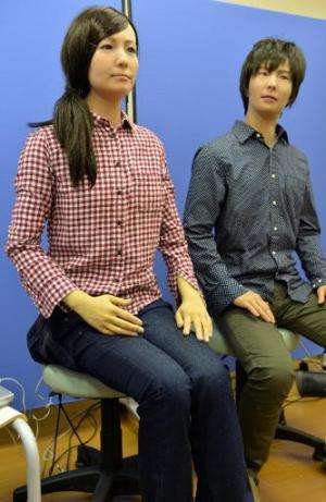 A male and female humanoid robots called &quot;Actroid F&quot;, produced by Japan's National Institute of Advanced Industrial Sc