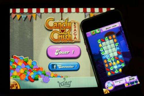 A man plays at Candy Crush Saga on his Iphone on January 25, 2014 in Rome