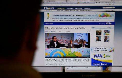 A man reads the a website in Rio de Janeiro on August 20, 2013