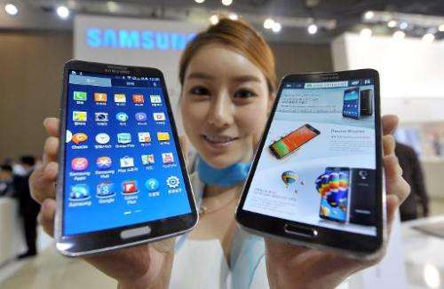 A model holds Samsung's first 'curved' smartphone Galaxy Round at the Electronics and IT Industry Fair in Goyang, north of Seoul