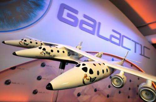 A model of the Virgin Galactic, the worlds first commercial spaceline, is displayed at the Farnborough International Airshow in