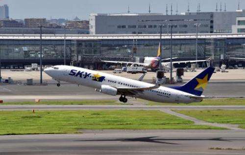 An airliner of Japan's Skymark Airlines takes off from Tokyo's Haneda airport, on August 19, 2014