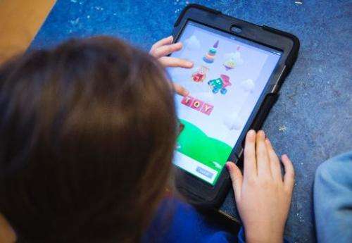 A Nnursery school pupil works with an iPads on March 3, 2014 in Stockholm