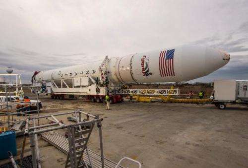 An Orbital Sciences Corporation Antares rocket is rolled out to a launchpad at NASA's Wallops Flight Facility on January 5, 2014