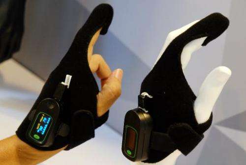 An Oximetry glove, designed by Taiwan Textile Research Institute, is displayed at the Computex tech show in Taipei on June 4, 20