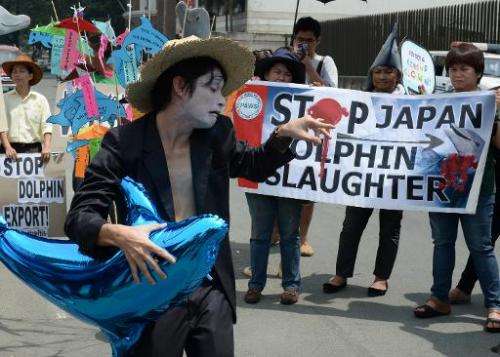 Anti-dolphin slaughter protesters at a rally in front of the Japanese embassy in Manila on September 2, 2013