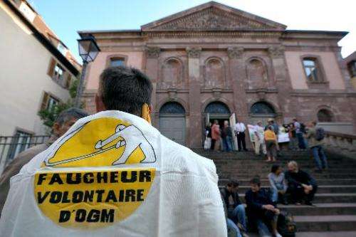 Anti-GMO demonstrators protest in front of Colmar courthouse on September 28, 2011 in eastern France