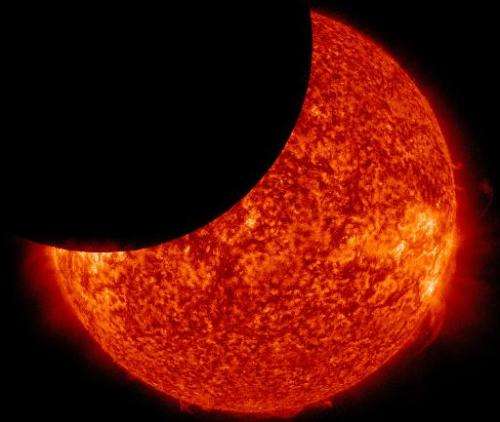 A partial solar eclipse is seen from space in this NASA image from January 30, 2014