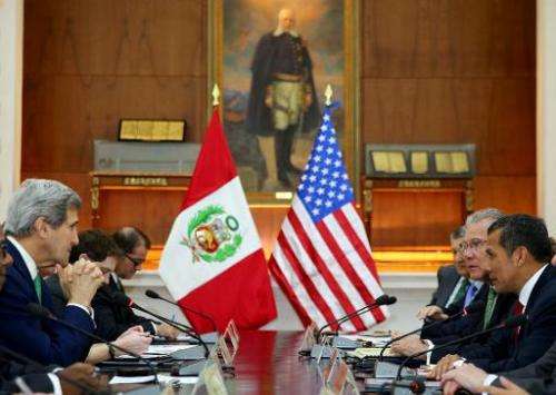 A picture distributed by the Peruvian presidency press office shows US Secretary of State John Kerry (L) in a working session wi