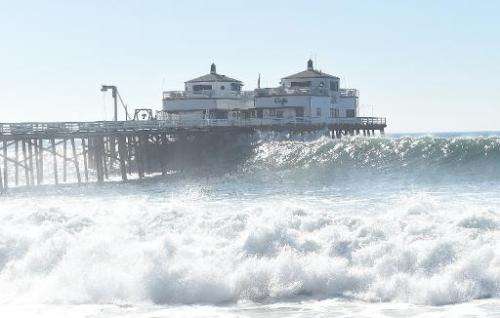 A pier near Malibu, California, is pictured during huge ocean swells generated by hurricane Marie, on August 27, 2014