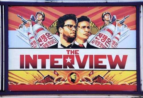 A poster for &quot;The Interview&quot;  is displayed on the marquee of the Los Feliz 3 cinema December 25, 2014 in Los Angeles, 
