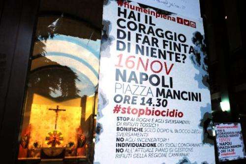 A poster in St. Paul's church in the southern Italian town of Caivano on November 14, 2013, announces a protest in Naples over i