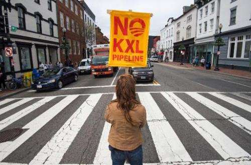 A protester blocks traffic on April 25, 2014 to protest the Keystone XL pipeline in Washington, DC