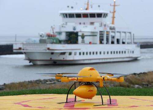 A quadrocopter remotely controlled DHL drone transporting medicines is pictured on November 18, 2014 in Norden-Norddeich, Gernma