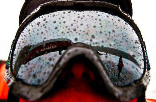 Argentinian military base of Camera is reflected on a scientist's glasses in Antarctica during a mission of the Brazilian Navy's