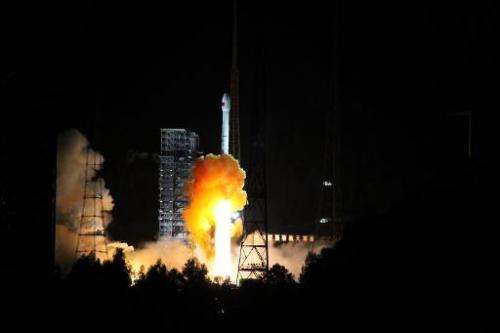 A rocket carrying an experimental spacecraft intended for the moon and back launches from Xichang space base in China's Sichuan 