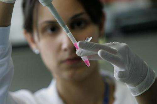 A scientific researcher extracts the RNA from embryonic stem cells in a laboratory, at the Univestiry of Sao Paulo's human genom