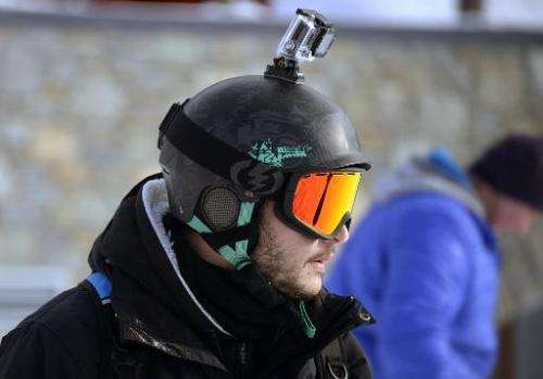 A skier carrying a GoPro camera on his helmet is pictured at Val Thorens, in the French Alps, during the ski station's opening w