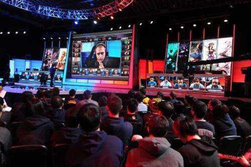 A studio audience watches a match between professional Team Curse and Cloud 9 during the League of Legends North American Champi