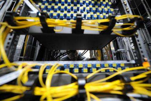 A telecommunications specialist mounts data storage equipment in Moscow, on February 7, 2012