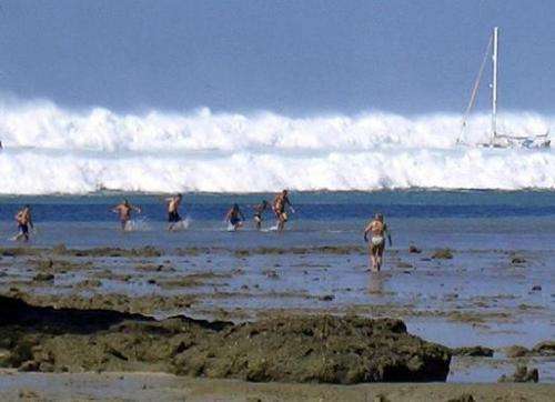 A tsunami wave rolls towards Hat Rai Lay Beach, near Krabi in southern Thailand, on December 26, 2004