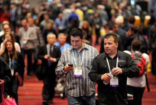 Attendees walk around the 2014 International CES at the Las Vegas Convention Center on January 7, 2014 in Las Vegas, Nevada