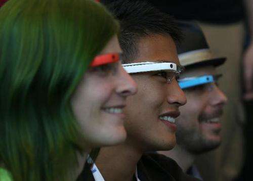 Attendees wear Google Glass while posing for a group photo during the Google I/O developer conference on May 17, 2013 in San Fra