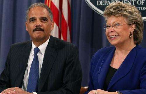 Attorney General Eric Holder (L), and EU Principal Vice-President Commissioner for Justice, Viviane Reding, participate in a mee