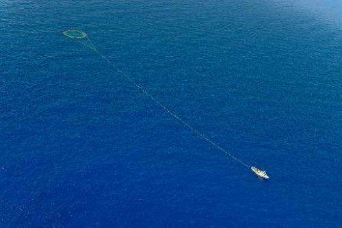 A tuna fishing boat drags nets through the Mediterranean sea during a Greenpeace protest action against overfishing of red tuna 