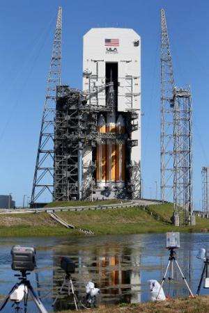 A United Launch Alliance Delta 4 rocket carrying NASA's first Orion deep space exploration craft sits on its launch pad in Cape 