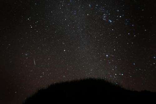 A view of a meteor shower over the National Park of El Teide on the Spanish canary island of Tenerife, on December 13, 2012