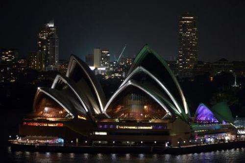 A view of Australia's iconic landmark Sydney Opera House during the annual Earth Hour on March 23, 2013, one minute brightly lit