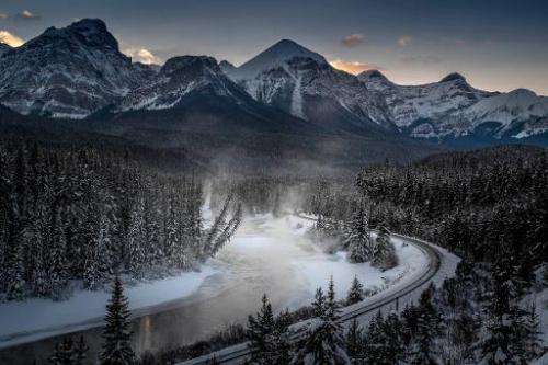 A view of the frozen Bow River and the Canadian Pacific Railway, seen at Banff National park near Lake Louise, Canada, on Decemb