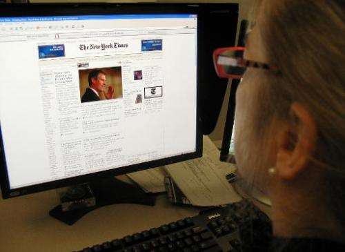 A woman reads the online version of the New York Times on January 20, 2010