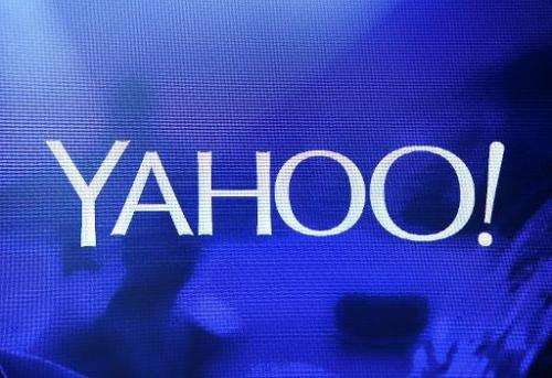 A Yahoo! logo is shown on a screen during a keynote address by President and CEO Marissa Mayer on January 7, 2014 in Las Vegas, 