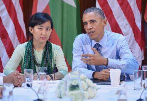 Barack Obama takes part in a civil society roundtable discussion at the US Embassy in Yangon on November 14, 2014