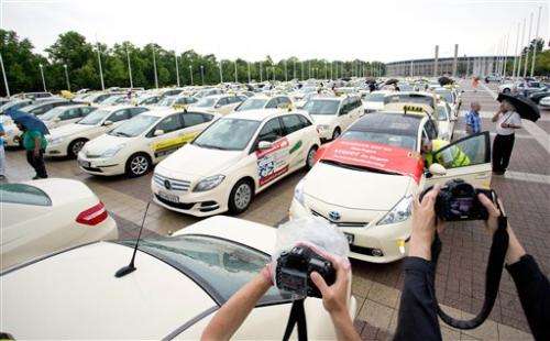 Berlin taxi drivers hail city's Uber ban