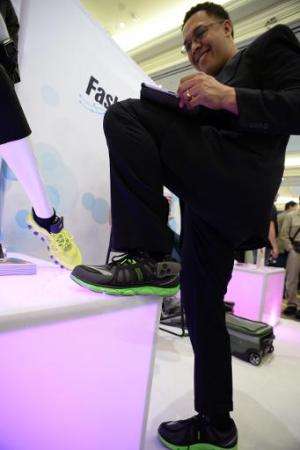 Boogio co-founder and CEO Jose Torres wears the Boogio pressure sensor insole at the 2014 International CES, January 9, 2014 in 