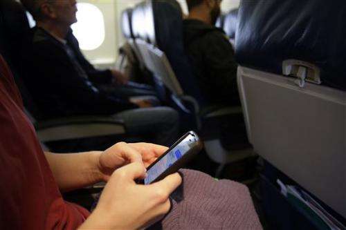 Cellphone calls on planes? Don't ask the feds