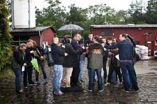 CEO of Copenhagen Zoo Steffen Straede (C back turned) speaks with the media on July 11, 2012