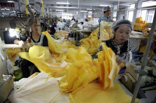 China factory whirs overtime to make Ebola suits